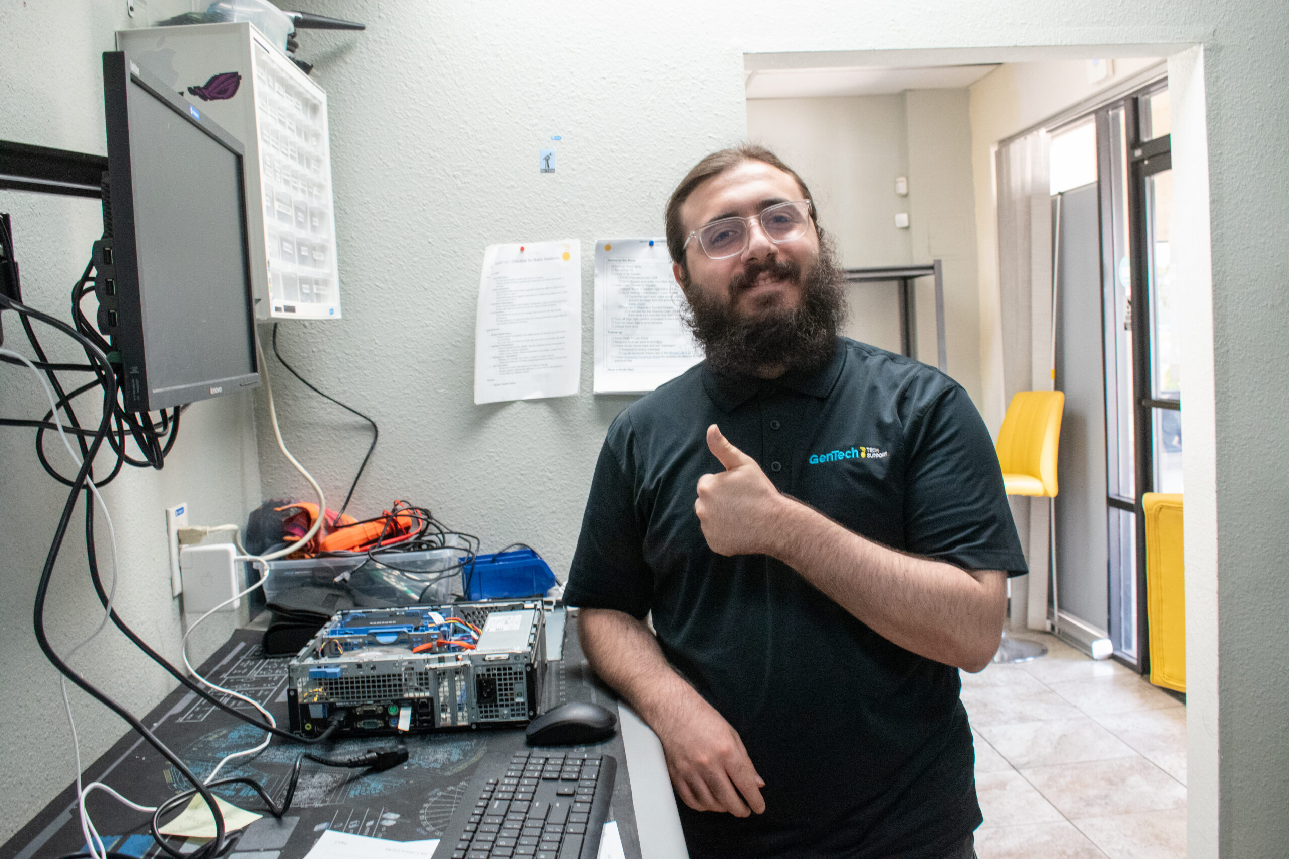 GenTech expert team member Brian working diligently on tech device systems