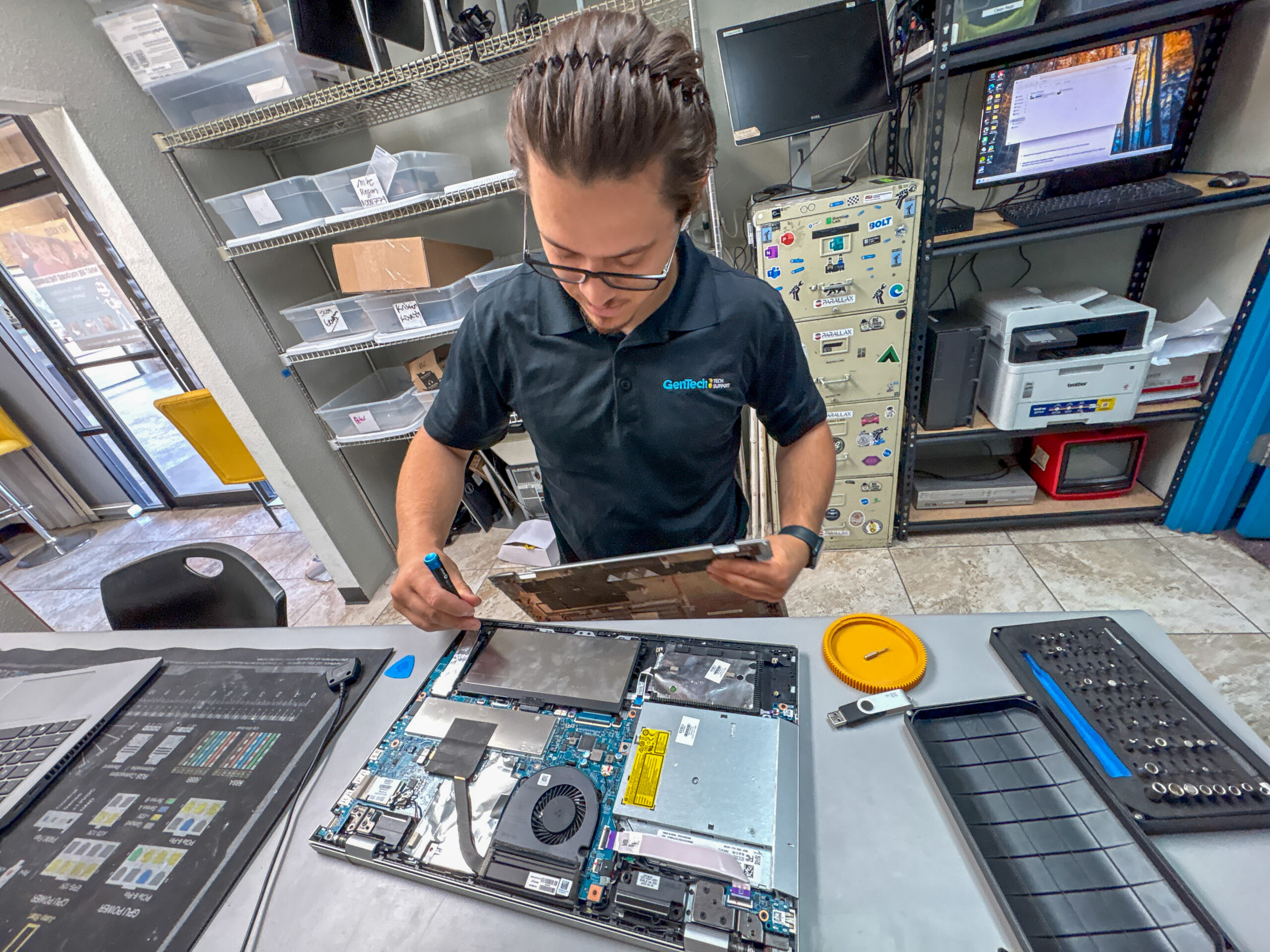 A technical support professional checking hardware components and resolving device issues completely