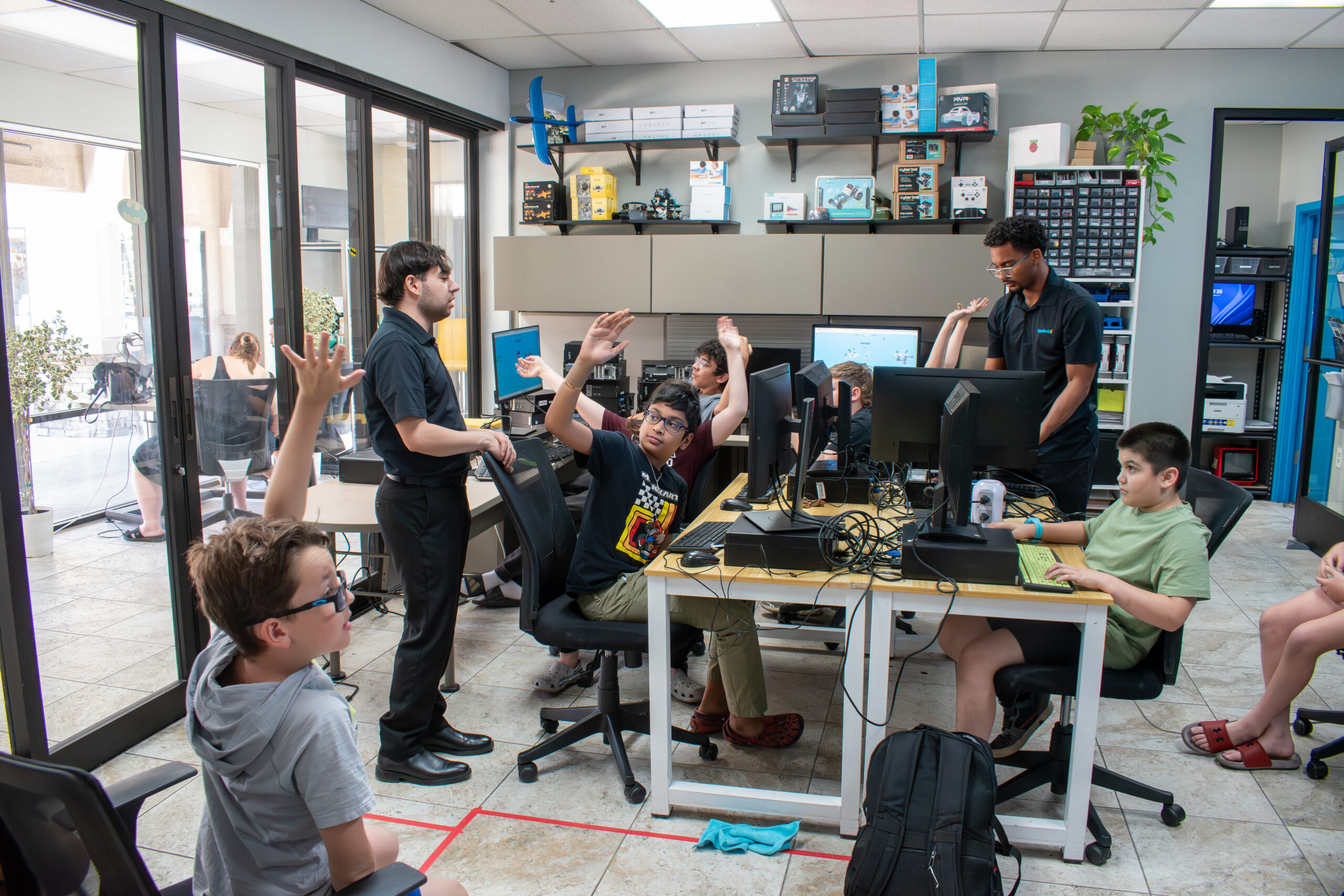 Students engaged in hands-on building and tech at GenTech Support lab